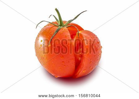 Tomato and a slice of tomato on white background