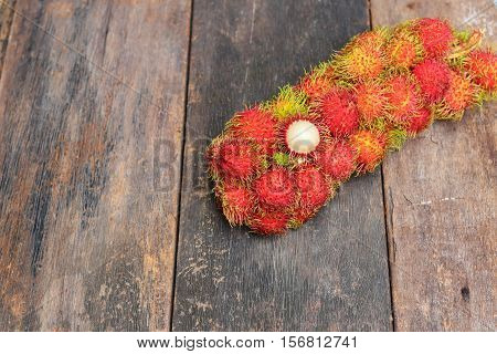 rambutan sweet fruit fresh on wood background