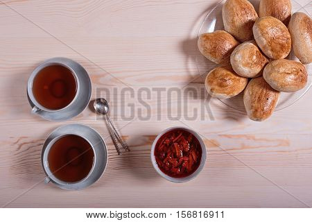 Homemade pie with strawberry jam on pink background.
