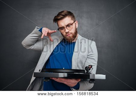Hipster with vynil. isolated black background