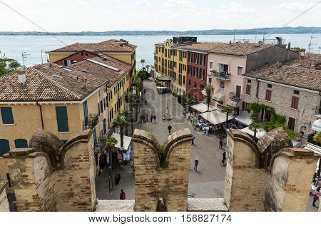 SIRMIONE ITALY - MAY 5 2016: View of Piazza Catello from the Scaliger Castle in Sirmione Lake Garda Italy