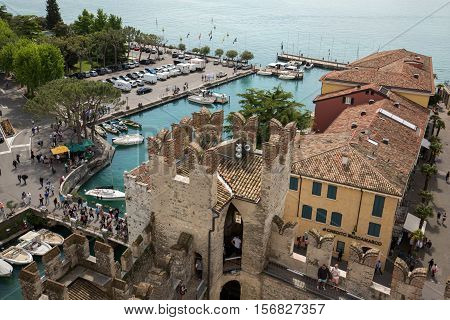 View of colorful old buildings in Sirmione and Lake Garda from Scaliger castle wall Italy