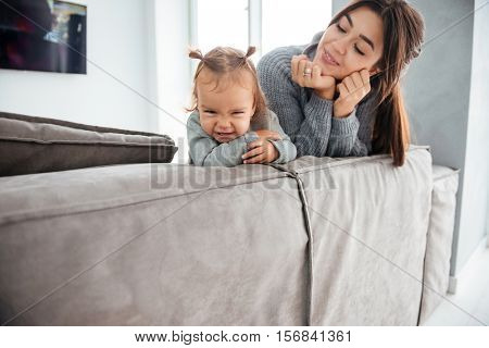 ?hild with mother on bed