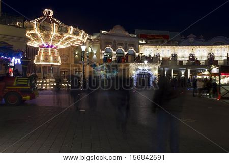 VIENNA, AUSTRIA - DECEMBER 31 2015: People at night at Prater amusement park in Vienna Austria