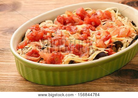 Casserole with roasted eggplants stuffed with minced meat.