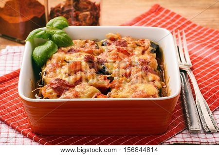 Casserole with roasted eggplants stuffed with minced meat.