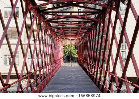 Girona (Gerona Catalunya Spain): red bridge over the Onyant river