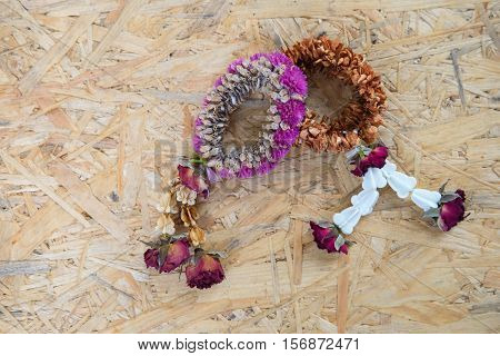 Dried Jasmine Garlands Phuang Malai on wood background