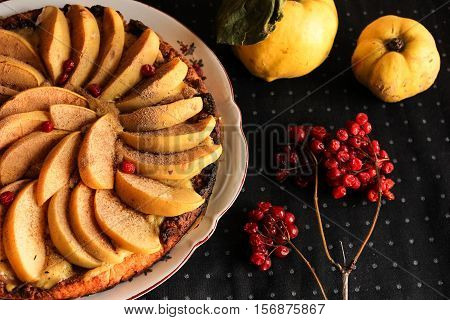 quince tart with custard open and shortcrust pastry. viburnum and cinnamon.