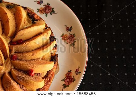 Homemade flour cake with quince and cooking utensils