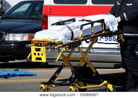 Emergency worker moving stretcher