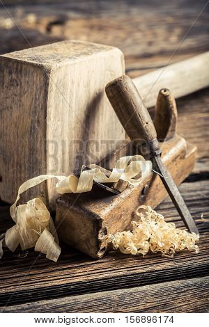 Wooden Hammer, Planer And Chisel On A Carpentry Workbench