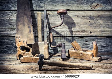 Hammer, Saw And Chisel On Carpentry Workbench