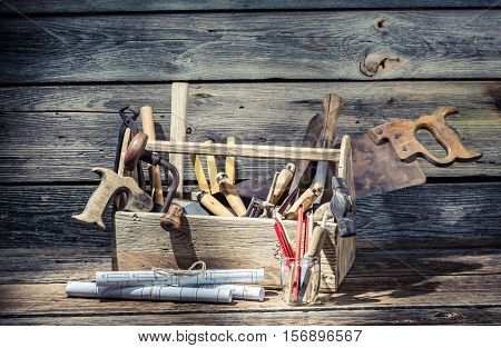 Hammer, Saw And Paper Scheme In The Carpentry Toolbox