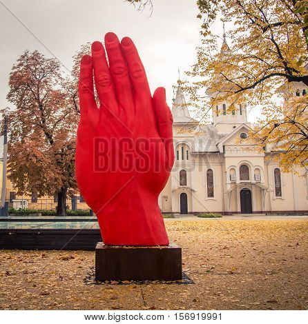 statue of a red hand in baia mare romania