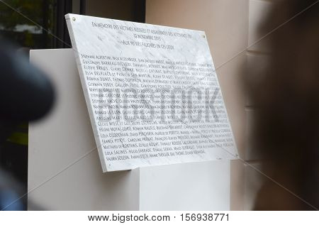 Paris, France - November 13, 2016:  Memorial stone with 90 names of victims at the Bataclan tribute to the victims of the attacks