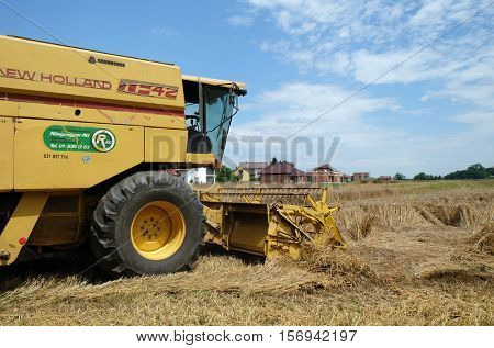 TRNOVEC, CROATIA - JULY 09, 2016: Combine harvester harvest ripe wheat on a farm in Trnovec, Croatia on July 09, 2016