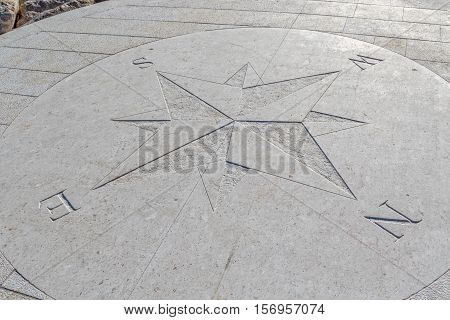 Compass engraved on the stone pier, Tucepi town.