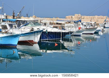 JAFFA ISRAEL 05 11 2016: Fishing boats over Mediterranean sea at old Jaffo marina. the ancient port, historical city of the Middle East