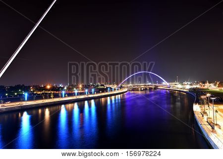 Dubai Skyline at night from new Dubai Canal, U.A.E