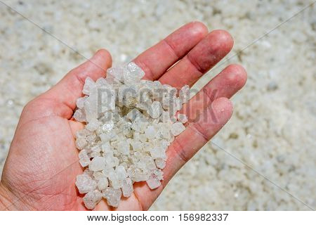 Holding Salt Crystals In Hand
