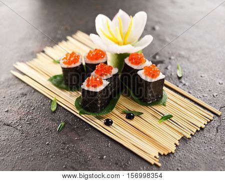 Ikura Maki Sushi - Roll with Cream Cheese inside. Topped with Ikura (Salmon Roe)