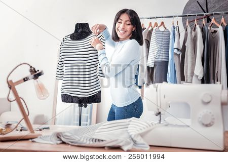 Waist Up Of Delighted Tailor Doing Measurements