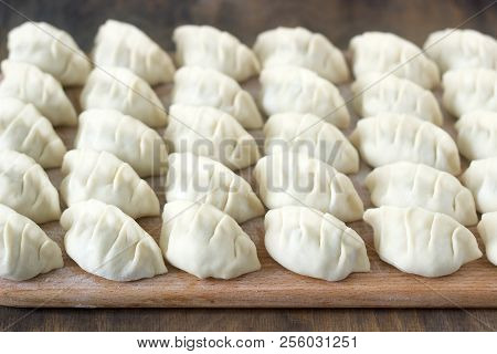 Many Raw Jiaozi Or Gedza Chinese Dumplings, Common In East Asia.