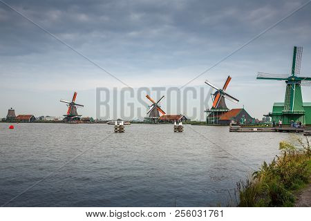 Zaanse Schans, Netherlands, August 19, 2015 - Traditional, Authentic Dutch Windmills At The River Za