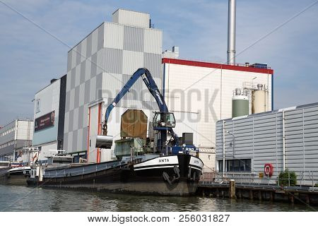 Zaanse Schans, Netherlands, August 19, 2015 - Industrial Area With Old Building, Boat And Crane.