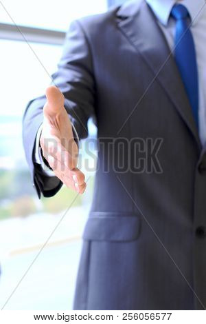 Unknown Business Man Offering Handshake While Standing Straight. Success Cooperation And Agreement C