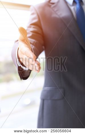 Unknown Business Man Offering Handshake While Standing Straight. Success Cooperation And Agreement C