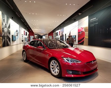 Honolulu - November 17, 2016: People Look At Cars Inside Tesla Store.  Tesla, Inc. Is An American Co