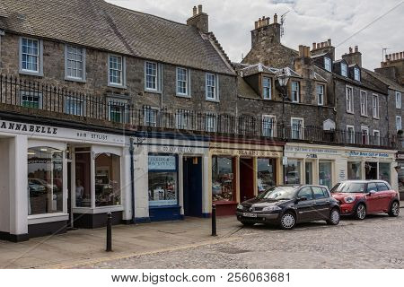 Queensferry, Scotland, Uk - June 14, 2012: Small Shops In The Shopping High Street. Shops Painted Fr