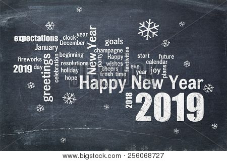 Happy New Year 2019 word cloud - white chalk text  on a blackboard, a greeting card