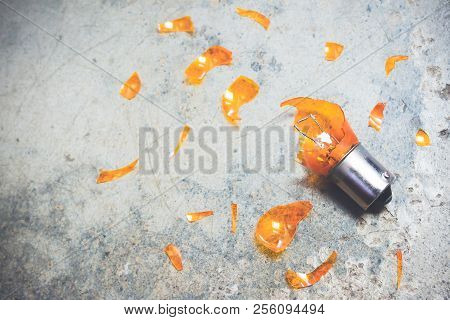 Damaged Light Bulb And Glass Shards