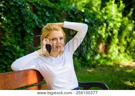 Woman Heard Bad News. Bad News. Girl Blonde Tense Face Talk Smartphone Green Nature Background. Woma