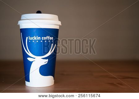 1 Septembre 2018, Wuhan China : A Coffee Cup Of Luckin Coffee On Wooden Table Background