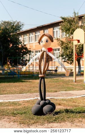 Balloon Man Dolly In The Summer Sun On School Garden