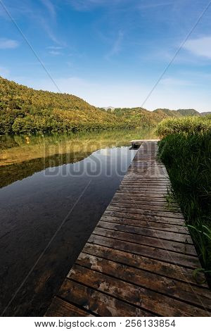 Lago Di Levico (lake) With Mountain And Forest, Levico Terme, Italy, Europe