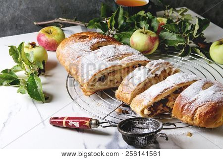 Homemade Sliced Puff Pastry Apple Strudel Pie On Cooling Rack Served With Ripe Fresh Apples, Branche