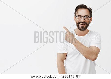 Happiness Is Just Around Corner. Portrait Of Charming Friendly And Carefree Caucasian Male With Bear