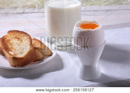 Morning Breakfast Set With Egg, Orange Jam On Bread Toast And Milk In Glass.