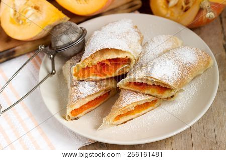 Traditional Romanian Or Moldovan Pumpkin Strudel Vertuta Served With Milk. Rustic Style.