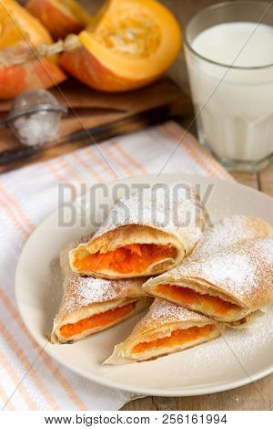Traditional Romanian Or Moldovan Pumpkin Strudel Vertuta Served With Milk. Rustic Style.