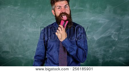School Stationery. Teacher Bearded Man With Pink Stapler Chalkboard Background. School Accident Prev