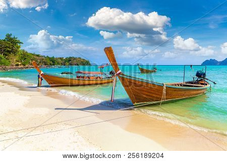 Traditional Thai Longtail Boat At Log Dalum Beach On Phi Phi Don Island, Thailand In A Summer Day