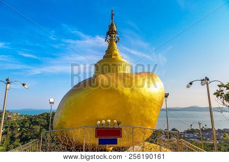 Replica Of Phra That In Kwaen (golden Rock) In Wat Koh Sirey Temple In Phuket In Thailand In A Summe