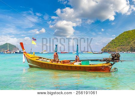 Traditional Long Tail Boat On Coral (ko He) Island Near Phuket Island, Thailand In A Summer Day