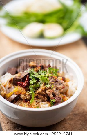 Northern Thai Food (kanom Jeen Nam Ngeaw) With Vegetables On Wooden Background,spicy Rice Noodles So
